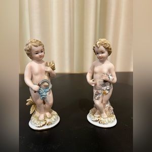 Pair of handpainted antique porcelain figurines.